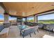 Covered patio features fireplace, TV, full seating, golf course views, and bar area at 11 Golden Sunray Ln, Las Vegas, NV 89135