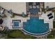 Aerial view of luxurious backyard oasis with custom pool, spa, fire features, and entertainment area at 11 Golden Sunray Ln, Las Vegas, NV 89135