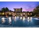 Back of house showing a sparkling swimming pool with underwater lights, complemented by the home's architectural design at 11 Golden Sunray Ln, Las Vegas, NV 89135