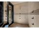 Modern shower with multiple showerheads and a glass door, offering a spa-like experience at 11 Golden Sunray Ln, Las Vegas, NV 89135