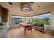 Bright spa area with massage table, seating, large windows, and outside views at 11 Golden Sunray Ln, Las Vegas, NV 89135