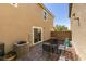 Cozy backyard patio area with brick pavers, privacy fence and outdoor seating at 1130 E Dorrell Ln, North Las Vegas, NV 89086