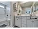 Modern bathroom featuring double sinks, and a shower-tub combo at 1130 E Dorrell Ln, North Las Vegas, NV 89086