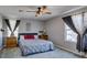 Cozy bedroom with a ceiling fan and lots of natural light at 1130 E Dorrell Ln, North Las Vegas, NV 89086