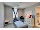 Small bedroom with a twin bed and a vintage baby stroller at 1130 E Dorrell Ln, North Las Vegas, NV 89086