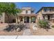 Charming two-story home with desert landscaping and a covered porch at 1130 E Dorrell Ln, North Las Vegas, NV 89086