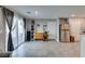Inviting living space featuring sliding glass doors and stainless steel refrigerator at 1130 E Dorrell Ln, North Las Vegas, NV 89086