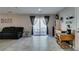 Bright living area with sliding glass doors leading to patio and comfortable furniture at 1130 E Dorrell Ln, North Las Vegas, NV 89086