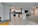 Open-concept living and kitchen space with updated appliances, fixtures and finishes at 1130 E Dorrell Ln, North Las Vegas, NV 89086