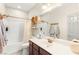 Well-lit bathroom with a vanity, shower, and bathtub combination at 11402 Newton Commons Dr # 102, Las Vegas, NV 89135