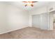 Bedroom with carpeted floor, ceiling fan, and closet at 11402 Newton Commons Dr # 102, Las Vegas, NV 89135