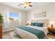 Bedroom with carpeted floor, ceiling fan, window, and neutral decor at 11402 Newton Commons Dr # 102, Las Vegas, NV 89135