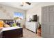 Charming bedroom with natural light, ceiling fan, and carpeted floors at 11402 Newton Commons Dr # 102, Las Vegas, NV 89135