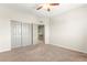 Bedroom with carpeted floor, ceiling fan, and closet at 11402 Newton Commons Dr # 102, Las Vegas, NV 89135