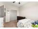 Bright bedroom featuring a ceiling fan, closet, and carpeted floors at 11402 Newton Commons Dr # 102, Las Vegas, NV 89135