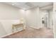 Second floor landing area featuring carpeted floor, neutral walls, and a stylish console table for added charm at 11402 Newton Commons Dr # 102, Las Vegas, NV 89135
