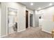 Spacious upstairs hallway with neutral paint and carpet leads to bedrooms and bathrooms, offering seamless transition at 11402 Newton Commons Dr # 102, Las Vegas, NV 89135