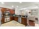 Stylish kitchen with dark cabinets, stainless steel appliances, and open layout at 11402 Newton Commons Dr # 102, Las Vegas, NV 89135
