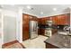 Well-equipped kitchen with stainless steel appliances, dark granite counters, and ample cabinet space at 11402 Newton Commons Dr # 102, Las Vegas, NV 89135