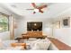 Comfortable living room with hardwood floors, ceiling fan, and contemporary decor at 11402 Newton Commons Dr # 102, Las Vegas, NV 89135