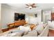 Cozy living room with plush seating, hardwood floors, and inviting atmosphere at 11402 Newton Commons Dr # 102, Las Vegas, NV 89135