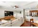 Spacious living room featuring hardwood floors, open layout, and modern furnishings at 11402 Newton Commons Dr # 102, Las Vegas, NV 89135