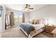 Serene main bedroom with large windows, neutral tones, and plush carpet at 11402 Newton Commons Dr # 102, Las Vegas, NV 89135