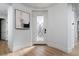 Bright foyer with detailed front door and wood-look floors at 11830 Kingsbarns Ct, Las Vegas, NV 89141