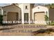 Charming home featuring a brick driveway leading to a two-car garage and landscaped front yard at 11830 Kingsbarns Ct, Las Vegas, NV 89141