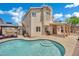 The expansive backyard includes an in-ground pool, covered patio, and ample lounge space at 1335 Passiflora Dr, Henderson, NV 89002