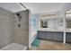 Modern bathroom featuring double sinks, a spacious shower, and a separate tub at 1335 Passiflora Dr, Henderson, NV 89002