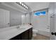 Well-lit bathroom featuring a single sink vanity, tile flooring, and a shower-tub combination at 1335 Passiflora Dr, Henderson, NV 89002