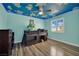 Unique room features themed ceiling, wood laminate floors, and cozy lofted bed area at 1335 Passiflora Dr, Henderson, NV 89002