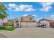 Charming two-story home features a well-manicured lawn and a spacious three-car garage at 1335 Passiflora Dr, Henderson, NV 89002