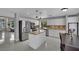 Modern kitchen featuring stainless steel appliances, center island, and white cabinetry at 1335 Passiflora Dr, Henderson, NV 89002