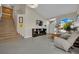Spacious living room with tall ceilings, tile floors, and open layout to the entryway at 1335 Passiflora Dr, Henderson, NV 89002