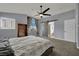 Spacious main bedroom with neutral tones, a barn door leading to the en suite, and ample natural light at 1335 Passiflora Dr, Henderson, NV 89002