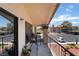 Inviting balcony with outdoor seating overlooking the community, trees, and parking area at 1575 W Warm Springs Rd # 2822, Henderson, NV 89014