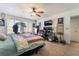 Bedroom featuring carpet, a ceiling fan, a large bed, and artwork on the walls at 1575 W Warm Springs Rd # 2822, Henderson, NV 89014