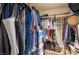 Organized closet with hanging clothes, shelves, and storage containers at 1575 W Warm Springs Rd # 2822, Henderson, NV 89014