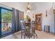 Bright dining space with access to balcony, complemented by unique furnishings at 1575 W Warm Springs Rd # 2822, Henderson, NV 89014