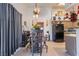 Charming dining area with a high table and chairs adjacent to the kitchen at 1575 W Warm Springs Rd # 2822, Henderson, NV 89014