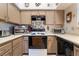 Kitchen with a range of appliances, counter space, and overhead storage at 1575 W Warm Springs Rd # 2822, Henderson, NV 89014