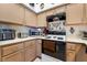 Well-equipped kitchen with modern appliances and plenty of cabinet storage at 1575 W Warm Springs Rd # 2822, Henderson, NV 89014