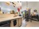 Functional kitchen area with a serving bar and access to a dining space at 1575 W Warm Springs Rd # 2822, Henderson, NV 89014