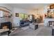 Living room with a fireplace, carpet flooring, neutral colors, and furniture at 1575 W Warm Springs Rd # 2822, Henderson, NV 89014