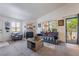 Bright living room featuring a fireplace, carpet, neutral walls, and lots of natural light at 1575 W Warm Springs Rd # 2822, Henderson, NV 89014