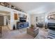 Cozy living room features a fireplace, ample seating, and rustic decor at 1575 W Warm Springs Rd # 2822, Henderson, NV 89014