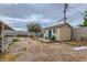 Backyard features shed and patio with room for outdoor activities and landscaping at 1607 Vegas Valley Dr, Las Vegas, NV 89169