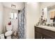 Bathroom features a shower/tub combo and a granite countertop vanity with dark wood cabinets at 1607 Vegas Valley Dr, Las Vegas, NV 89169